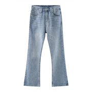 Medium wash wide-leg denim jeans with carpenter pockets and a flared hem.