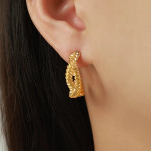 Gold vermeil braided hoop stud earrings with a textured rope design.