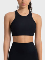 Black ribbed racerback crop top with contour stitching and a high neckline.
