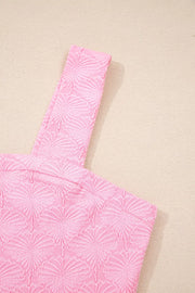 Pink textured square neck tank top with floral pattern and wide straps.