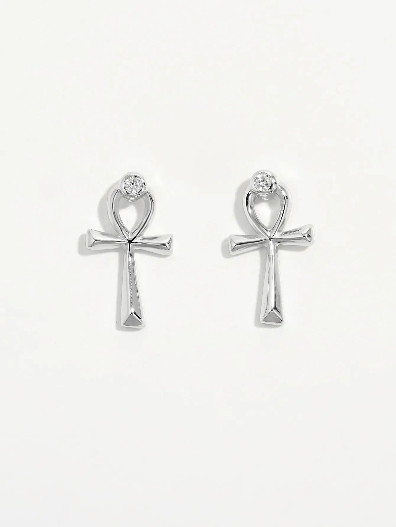 Silver ankh stud earrings with zircon detail