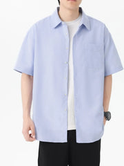 Button-down Oversized Short-sleeve Top in Blue, model styling view