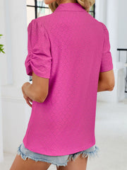 Hot pink eyelet ruched short sleeve blouse with a collared neckline.
