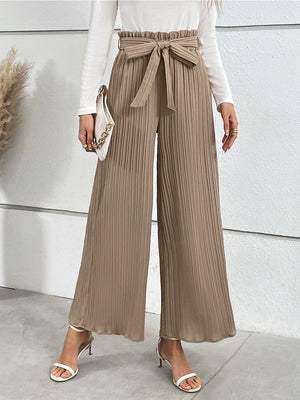 Camel pleated palazzo trousers with tie waist and wide legs.