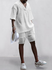 White cable-knit v-neck two-piece set with shorts and short sleeves.