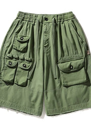 Green men's cargo shorts with multiple pockets and drawstring waist.