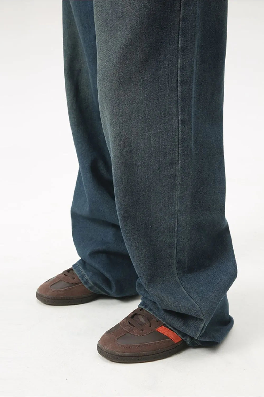 Baggy denim jeans in medium wash with subtle fading and a relaxed fit.