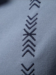 Dusty blue piqué polo shirt with embroidered chevron detail