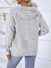 Textured knit zip-up cardigan in white with a subtle charcoal fleck pattern and a cozy hood.