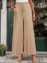 Tan textured wide-leg drawstring trousers with pockets