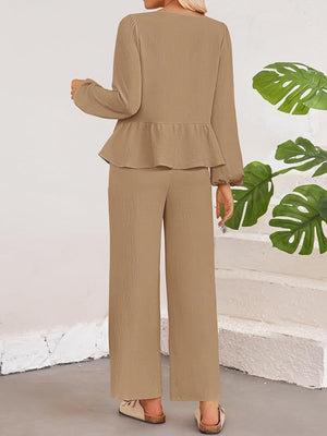 Camel textured peplum tie-neck co-ord set with balloon sleeves and wide-leg pants.