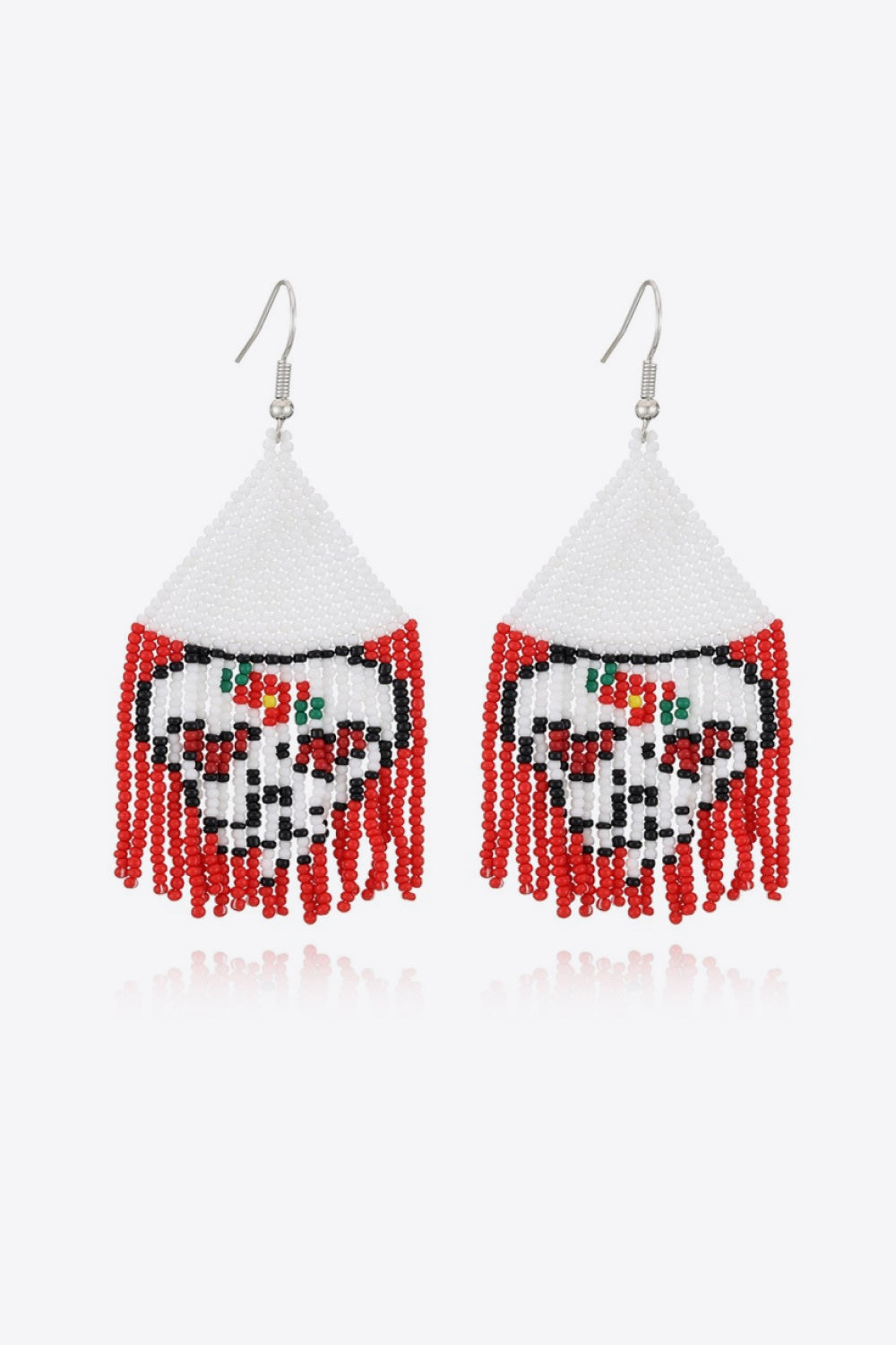 Beaded skull fringe earrings with white, black, red, and green beads.