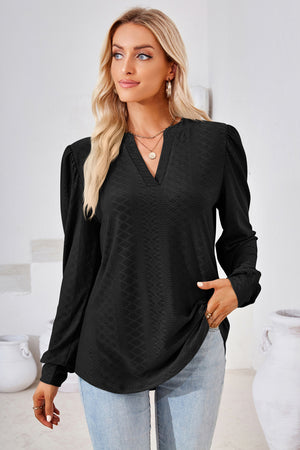 Black textured blouse with bishop sleeves and a V-neckline