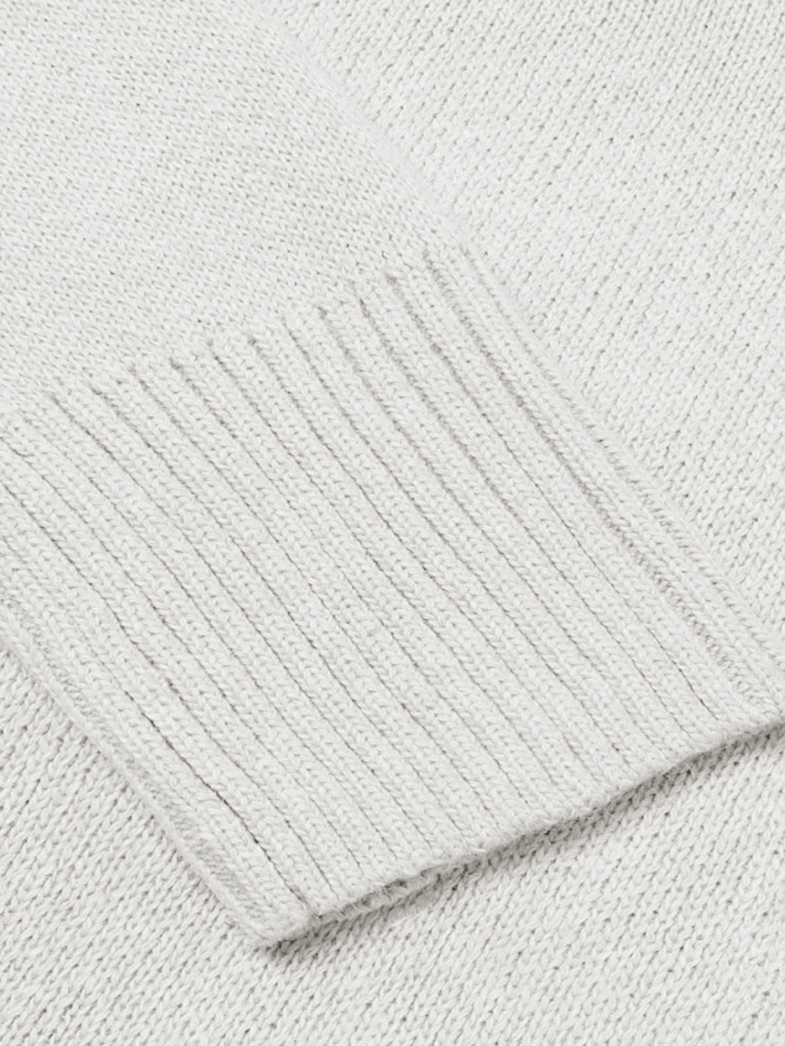 Ribbed trim V-neck knit sweater in Cloudy Blue, showing close-up of textured knit fabric and ribbed cuff.