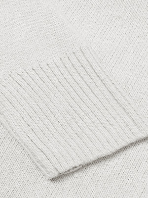 Ribbed trim V-neck knit sweater in Cloudy Blue, showing close-up of textured knit fabric and ribbed cuff.