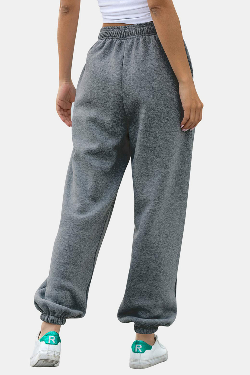 Relaxed-fit gray sweatpants with cuffed ankles and elastic waistband.