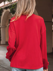 Red cotton crewneck sweatshirt with long sleeves.