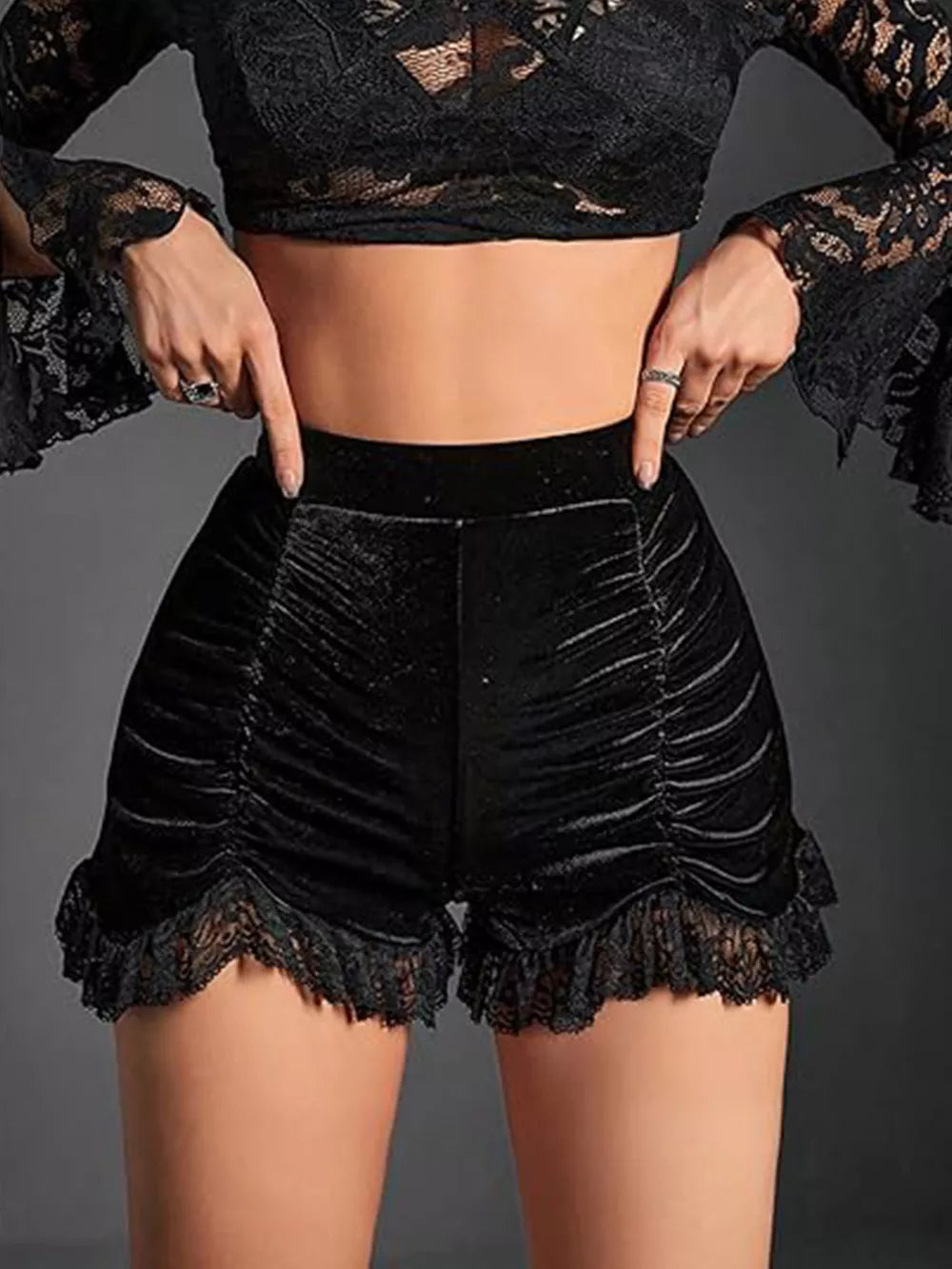 Black ruched velvet high-waisted shorts with lace trim hem