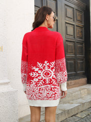 Red knit mini dress with white snowflake intarsia pattern and white cuffs.