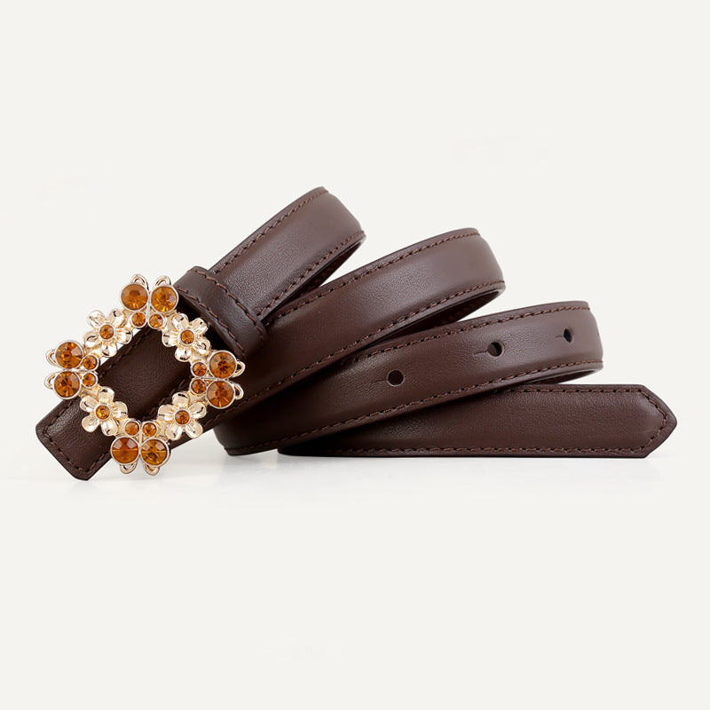 Brown leather belt with ornate gold buckle and amber rhinestones.