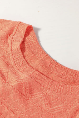 Textured knit drawstring short set in sherbet, close-up of neckline and textured pattern.