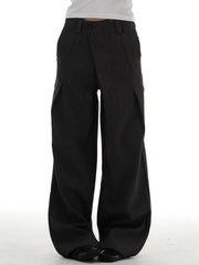 Men's black wide-leg pleated trousers with a comfortable drape.