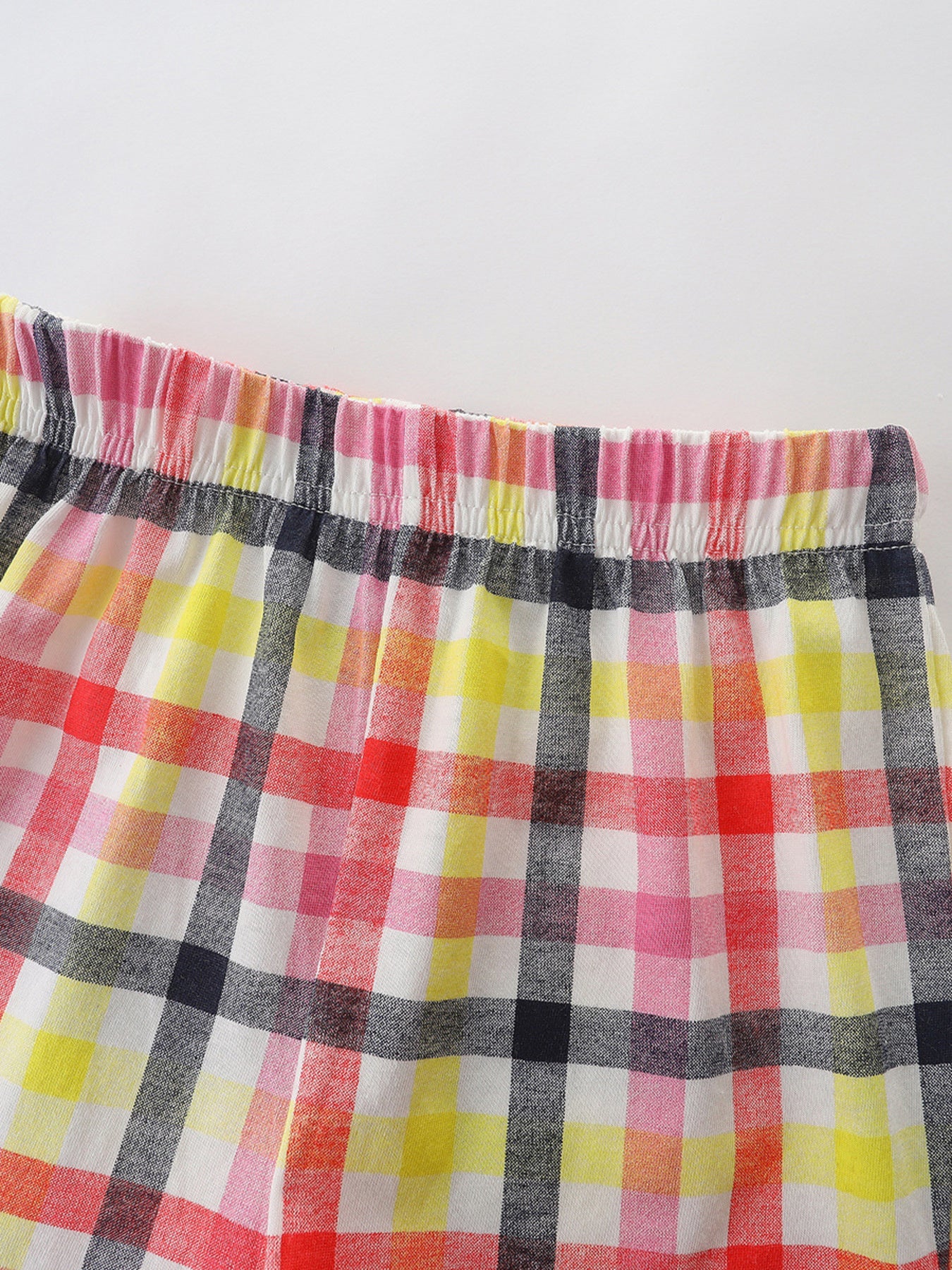 Baby shorts with elastic waistband in colorful plaid pattern