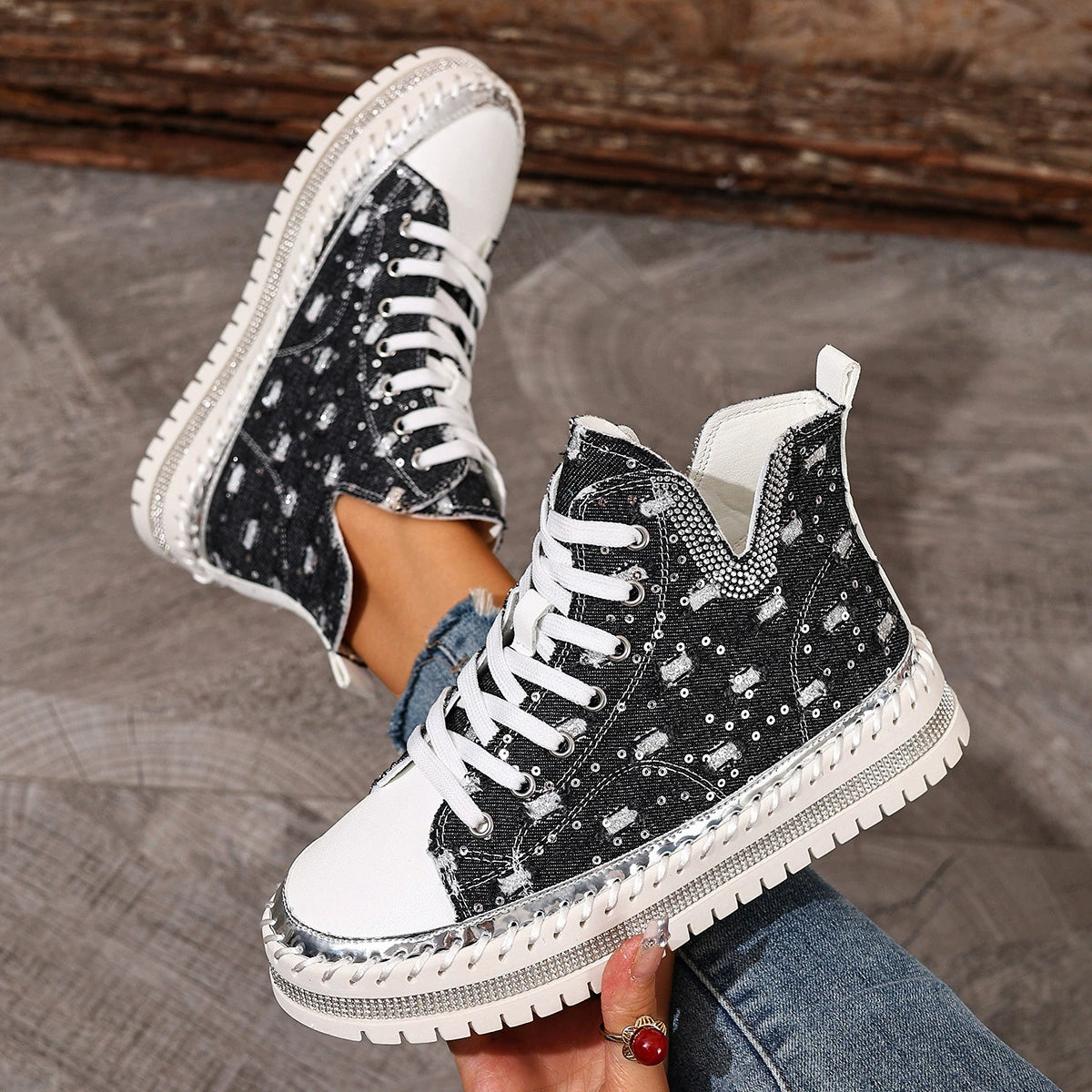 Black canvas high-top sneakers with rhinestone embellishments and chunky sole.