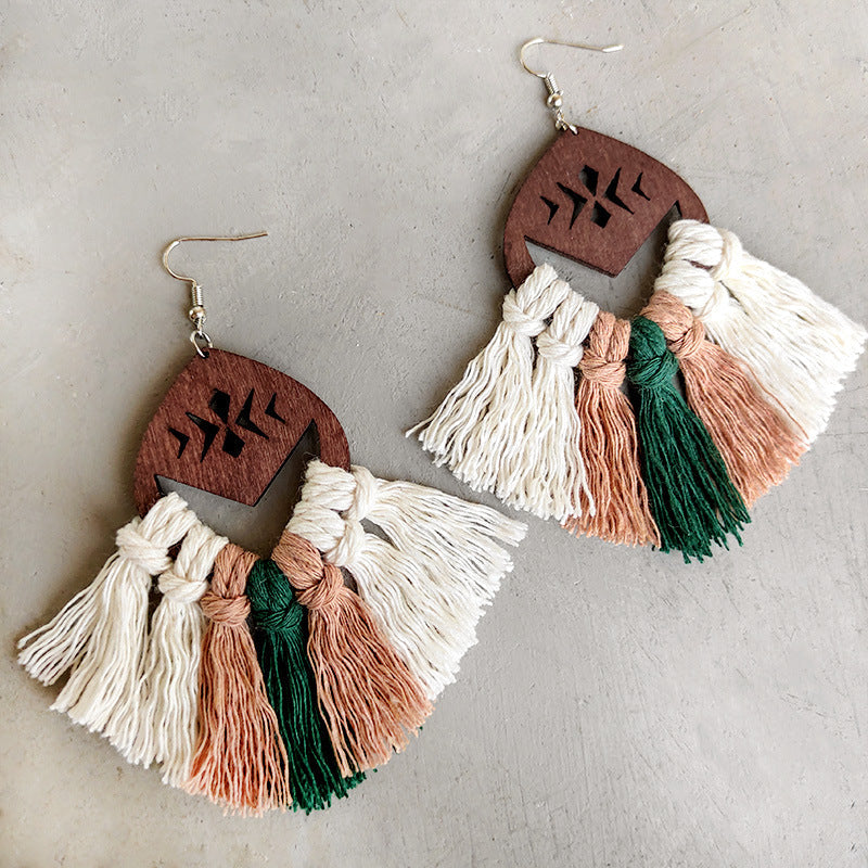 Geometric macrame tassel earrings with wood detail in white, rust, and green.