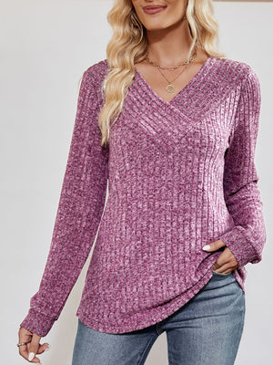 Lilac textured ribbed V-neck pullover sweater with long sleeves.