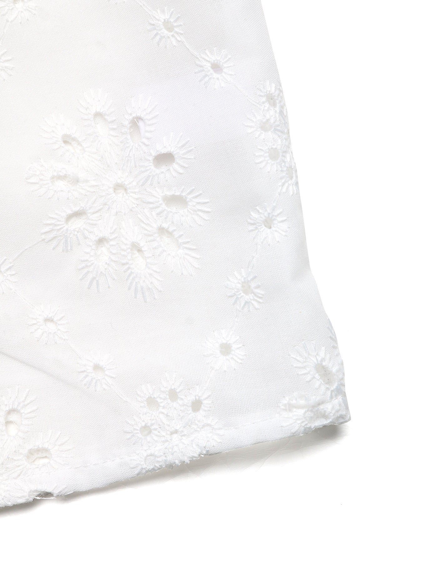 White eyelet embroidered maternity overshirt with floral cutouts and button-up detail.