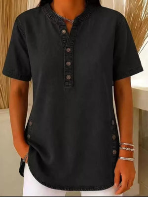 Black denim-inspired short sleeve button-down blouse with side button detail.