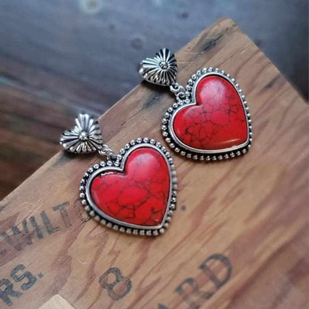 Deep red heart stone drop earrings with silver alloy boho detailing.