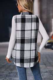 Plaid utility vest in black and white, 100% polyester, buttoned, with patch pockets.