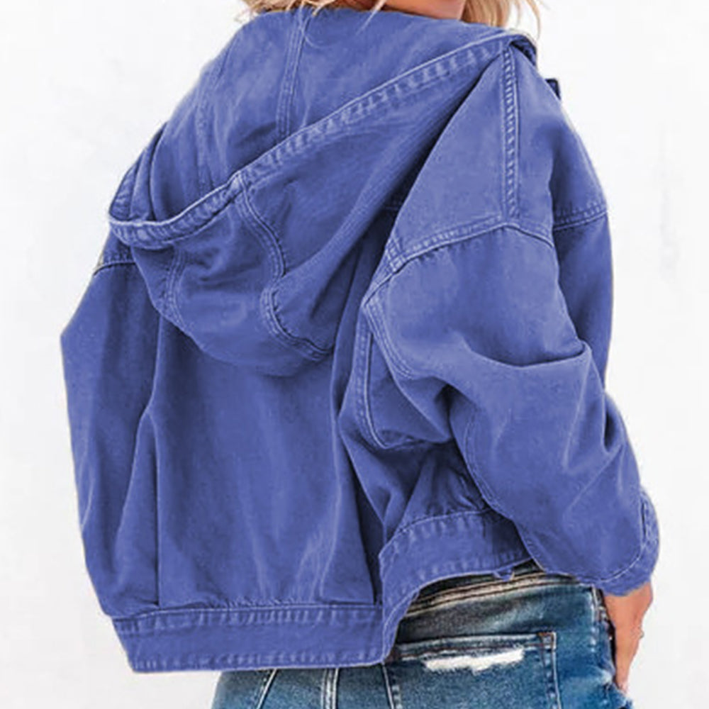 Royal blue denim utility hoodie with hood and buttoned cuffs, styled with jeans.