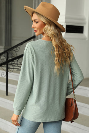Textured Henley V-Neck Top in Light Green with long sleeves and a subtle diamond pattern.