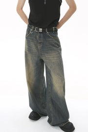 Faded wash palazzo denim trousers in medium blue, featuring a relaxed fit and wide leg.