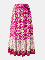 Tiered maxi skirt in hot pink with medallion print and elastic waist.