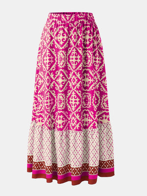 Tiered maxi skirt in hot pink with medallion print and elastic waist.