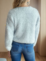 Fluffy acrylic cardigan in Mint Blue with a crew neck and long sleeves.