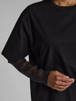 Black oversized tee with sheer, sparkly long sleeves.