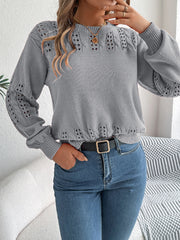 Gray acrylic knit sweater with openwork detail on sleeves and neckline.