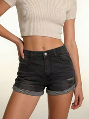 Black distressed denim roll-up shorts with button fly and cuffed hems.