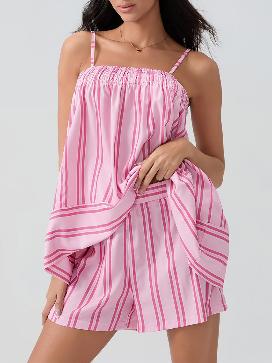 Pink striped smocked cami and shorts set with square neckline and adjustable straps.