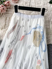 White tulle skirt with abstract whimsical print and stars.