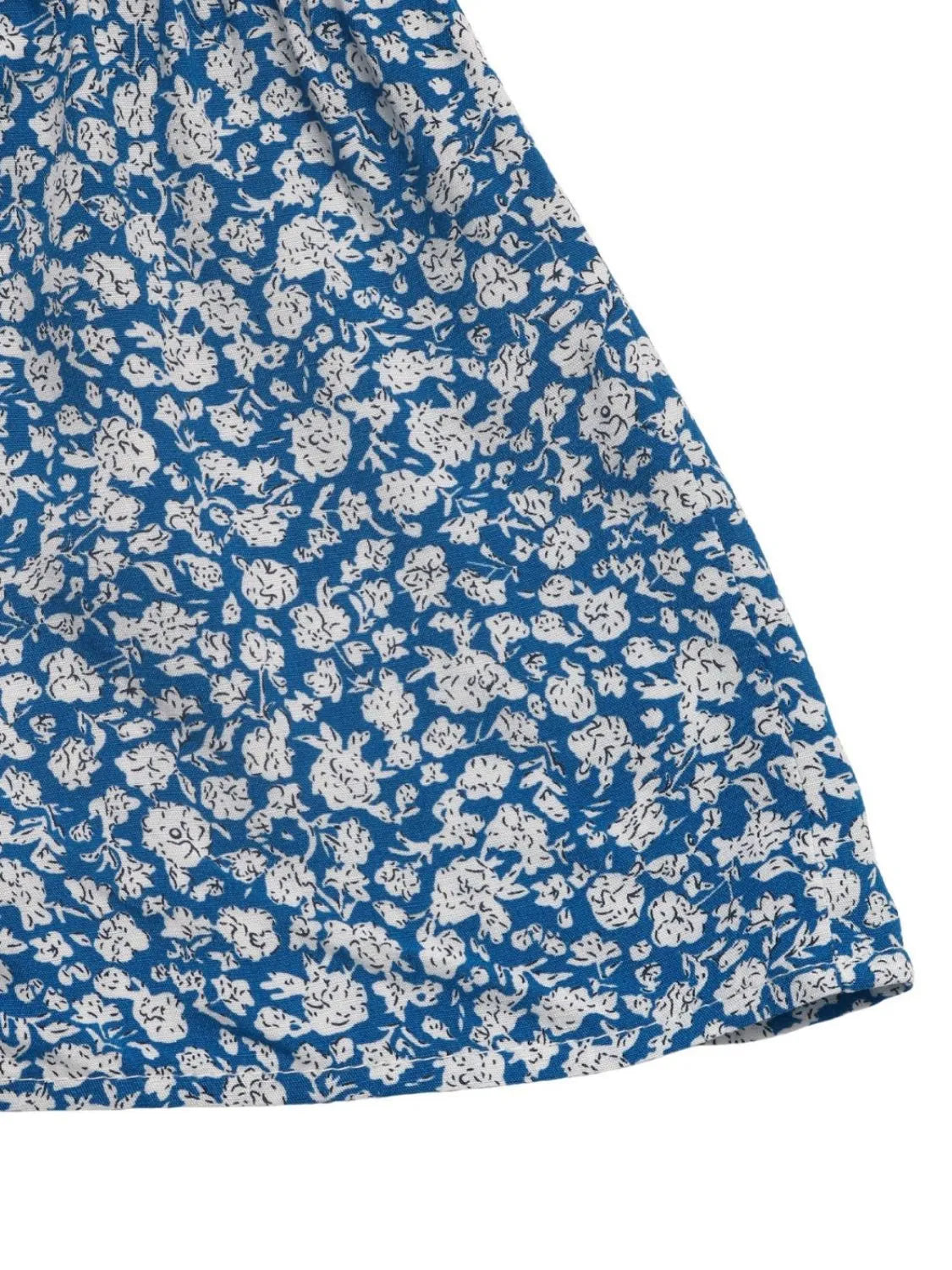 Light blue ditsy floral mini skirt with a ruffled hem detail.