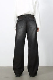 Faded dark wide-leg denim jeans with a relaxed fit.