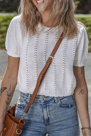 White eyelet knit puff sleeve top with vertical stitch detail.