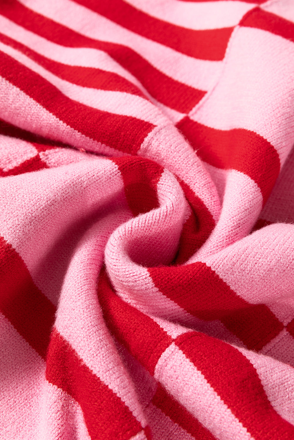 Colorblock stripe knit sweater in hot pink with red stripes and balloon sleeves.