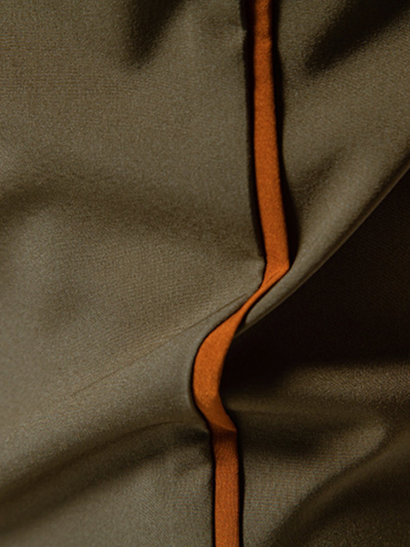Olive green button-down shirt with orange contrast trim detail